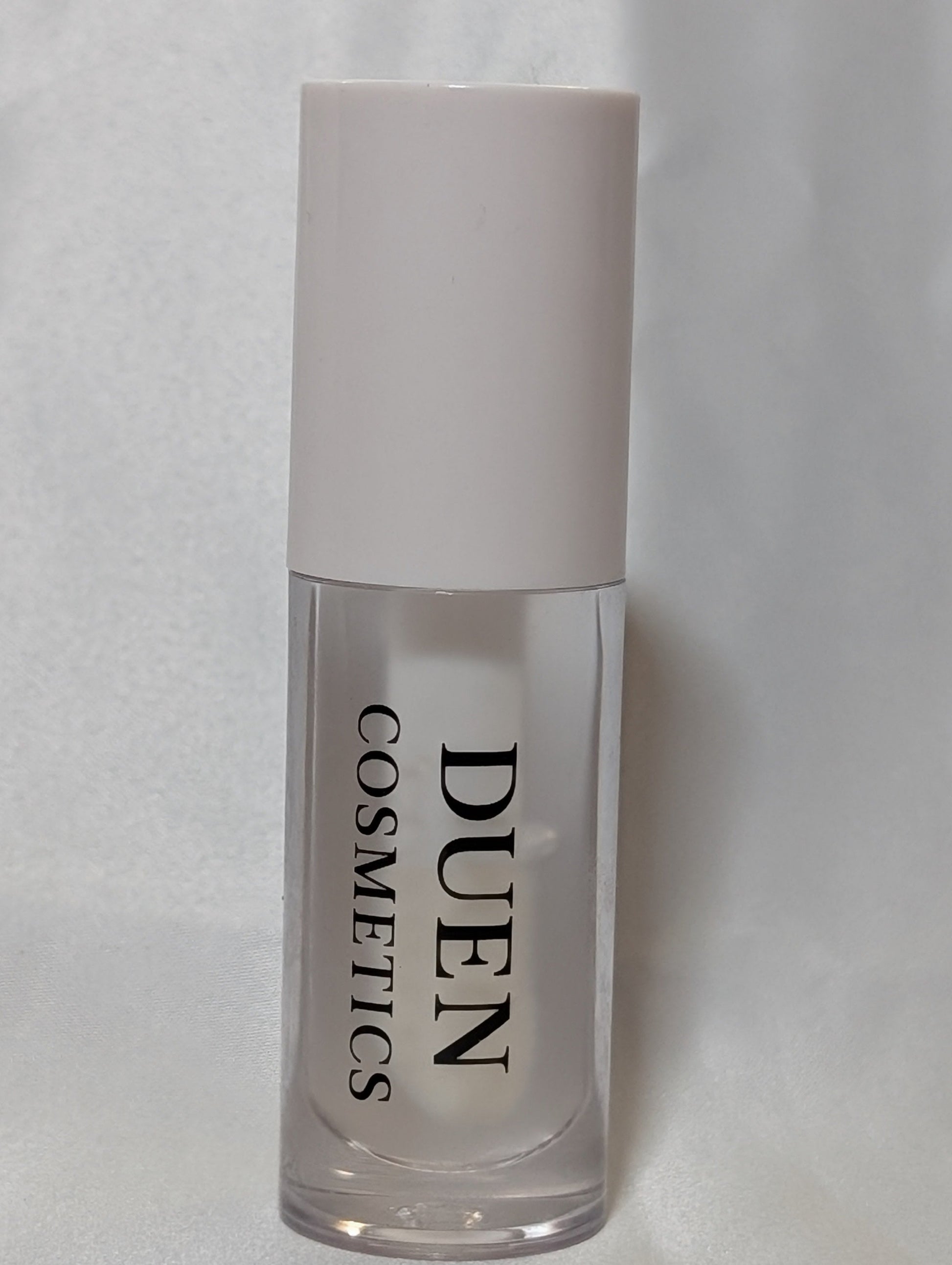 Cosmetic bottle with 'Duen Cosmetics' clear unscented Lipgloss 